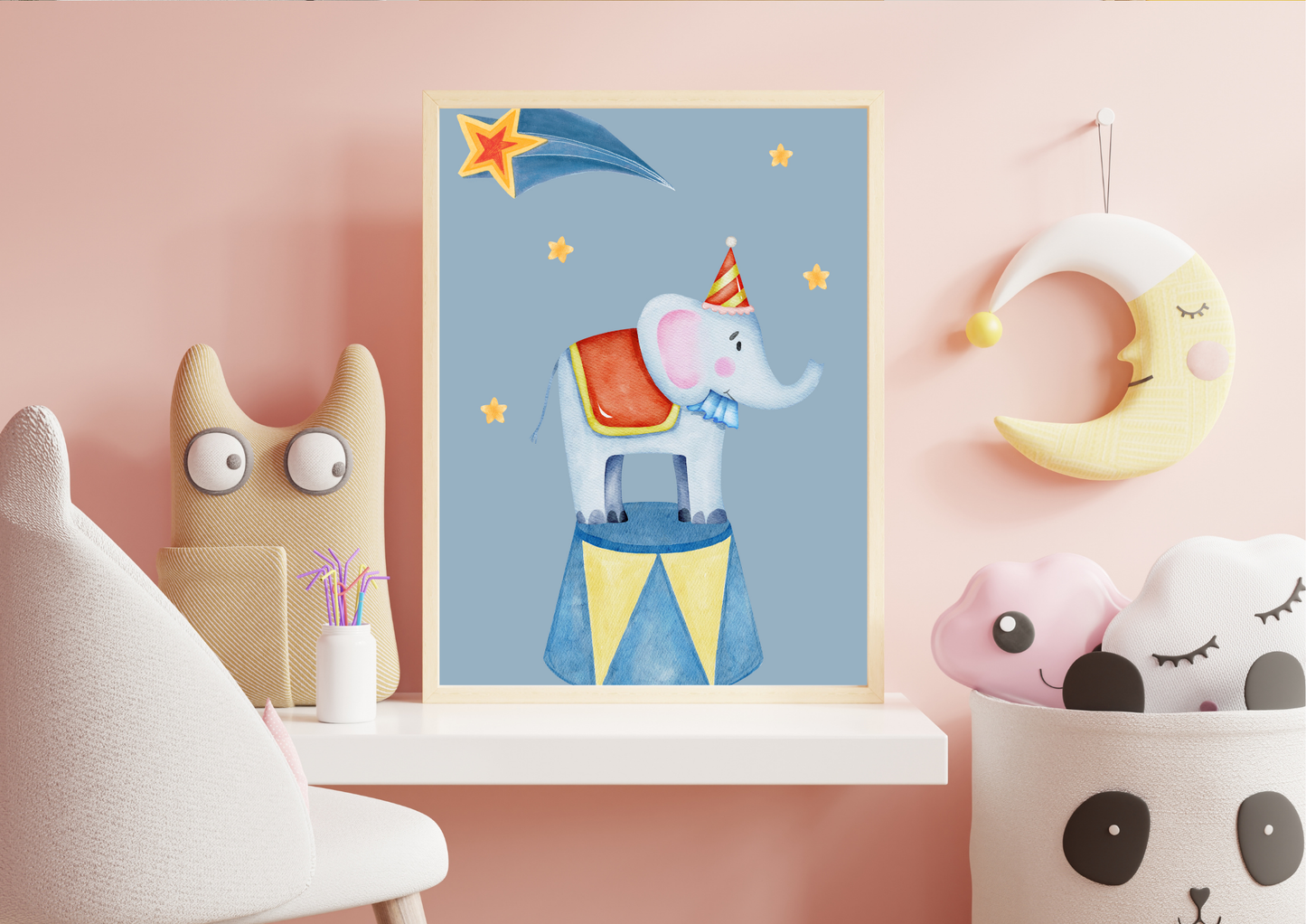 Children's room decor with a framed picture of an elephant on a blue background, surrounded by toys and a chair.