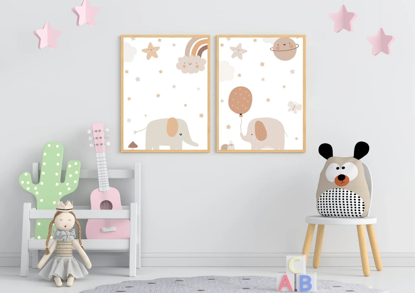 Children's room with wall art, toys, and a set of two elephant nursery prints on a light gray wall.