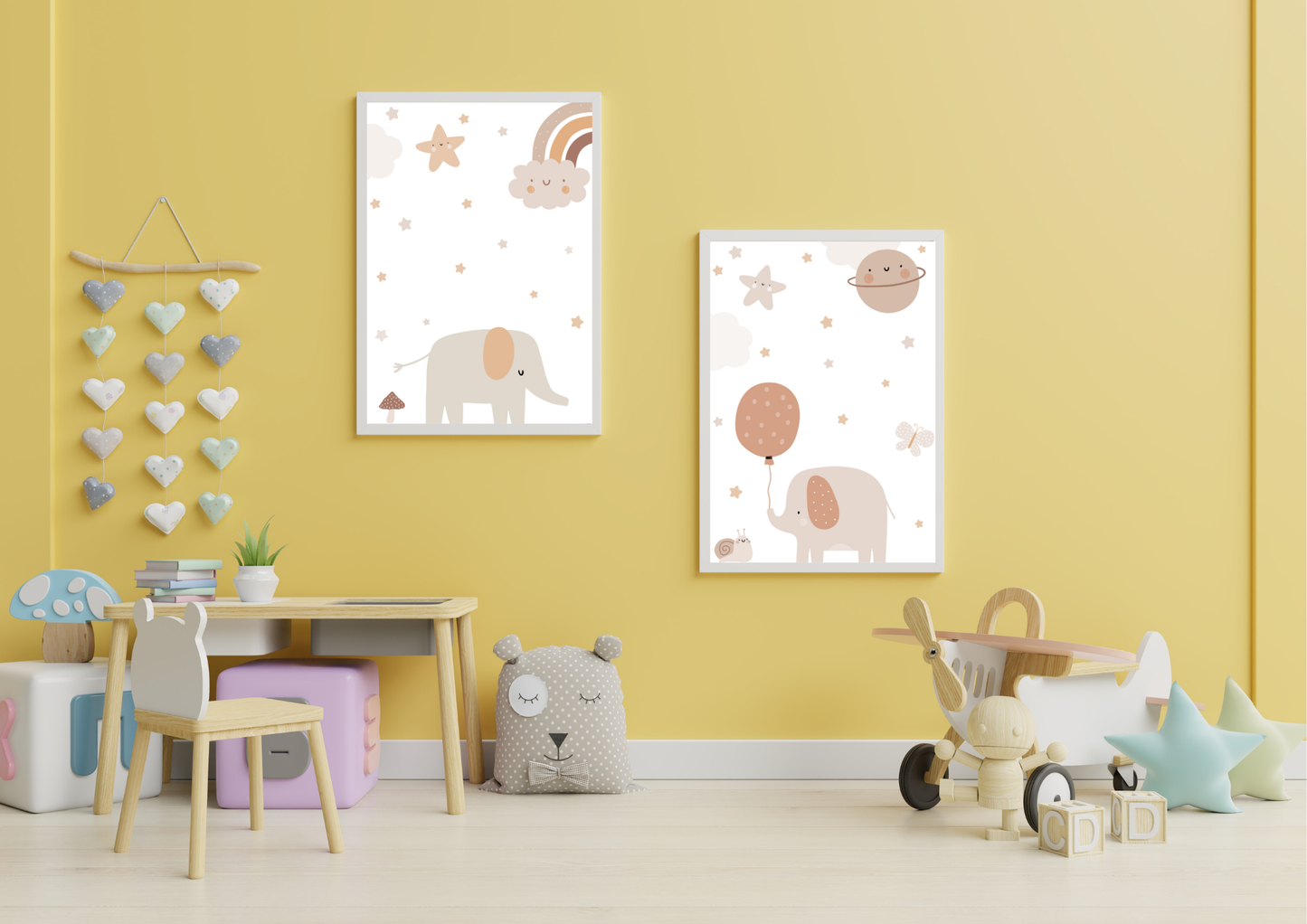 Children's room with yellow walls, framed posters of elephants and balloons, and toys.