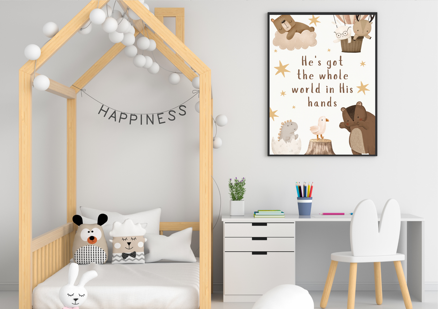 Children's bedroom with a wooden bed, desk, and decorative religious themed nursery wall art.