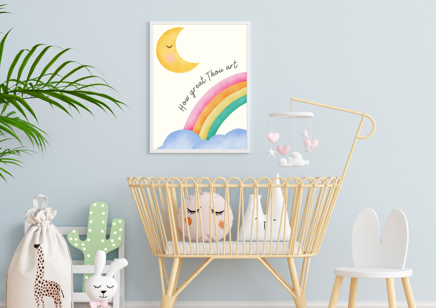 Nursery room with a crib, decorative items, and a religious wall art print with a rainbow and moon.