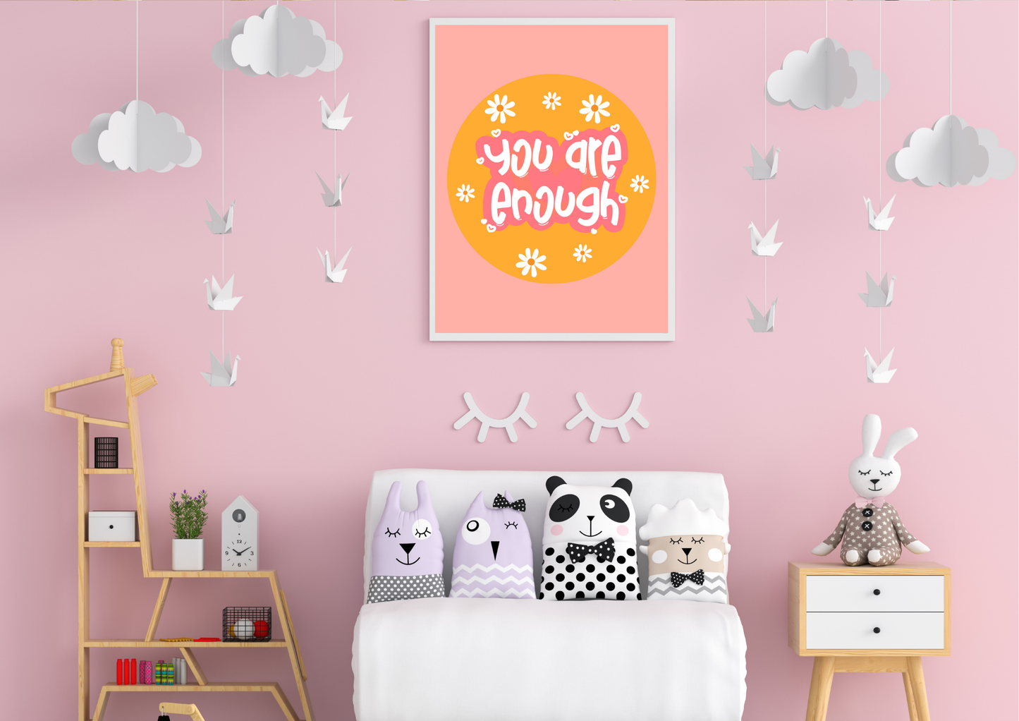 Children's bedroom with pink walls, cloud decorations, and a motivational "you are enough" poster.