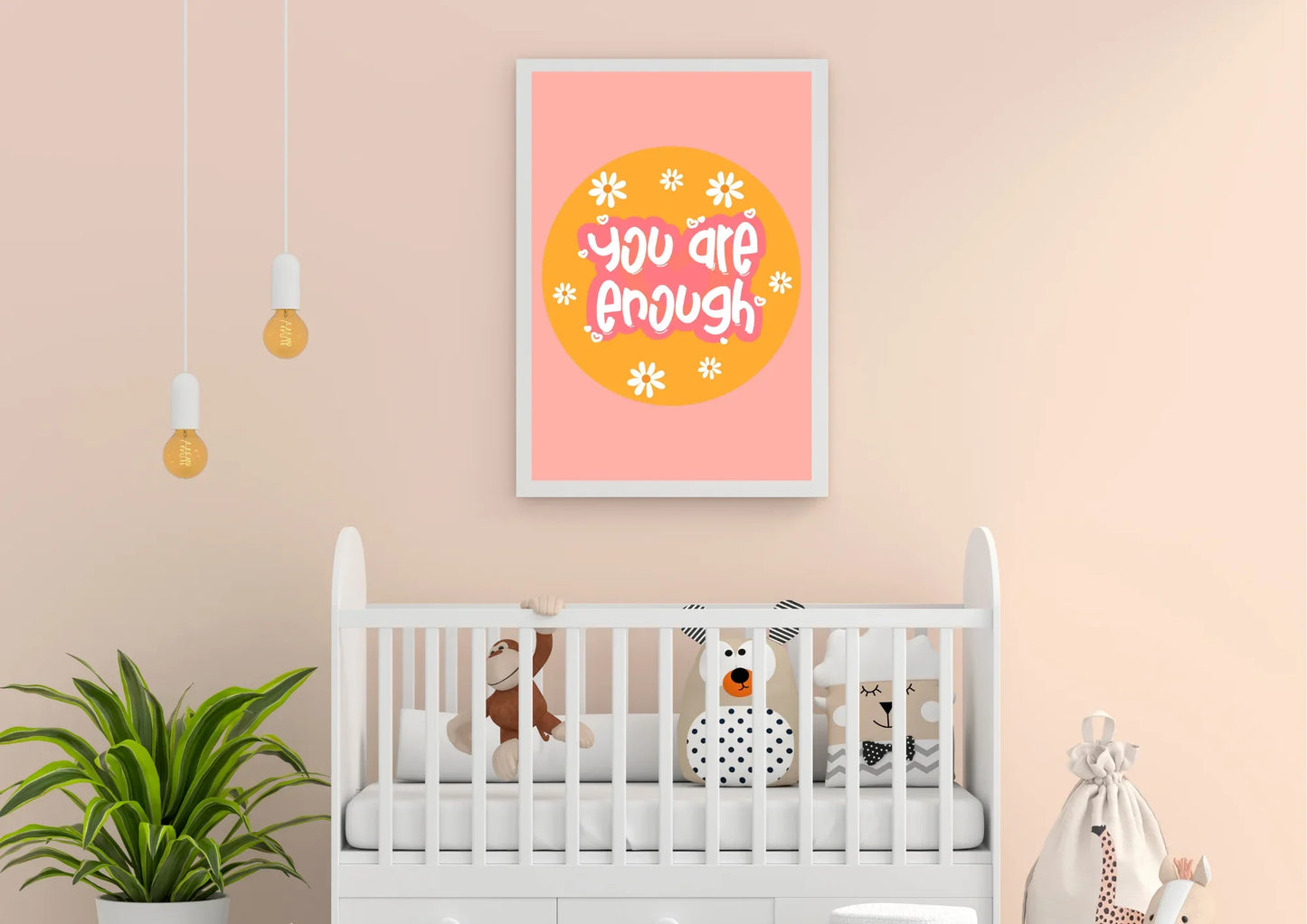 Nursery room with a white crib, stuffed animals, and a motivational poster on a pink wall.
