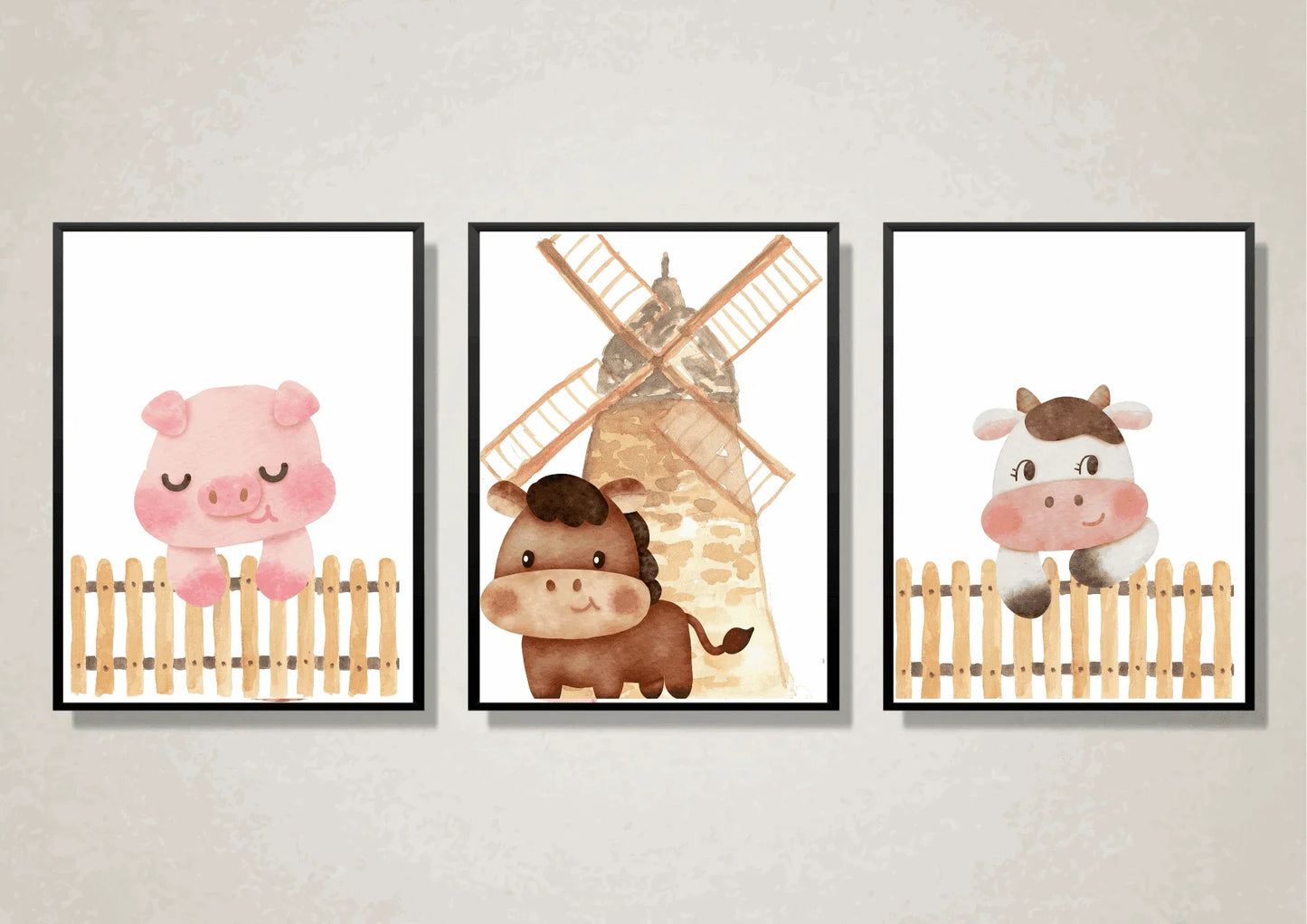 Close-up of three framed watercolor farm animal art prints featuring a cute pig, a horse with a windmill, and a cow behind a wooden fence.