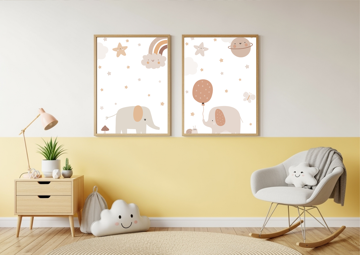 A brightly styled nursery or reading corner with a wall painted white on top and a cheerful yellow below. A set of two framed prints featuring cute elephants, stars, and celestial elements in neutral tones hangs in the center. A wooden nightstand with a pink lamp, a cloud-shaped pillow on the floor, and a white rocking chair with a star pillow are visible.