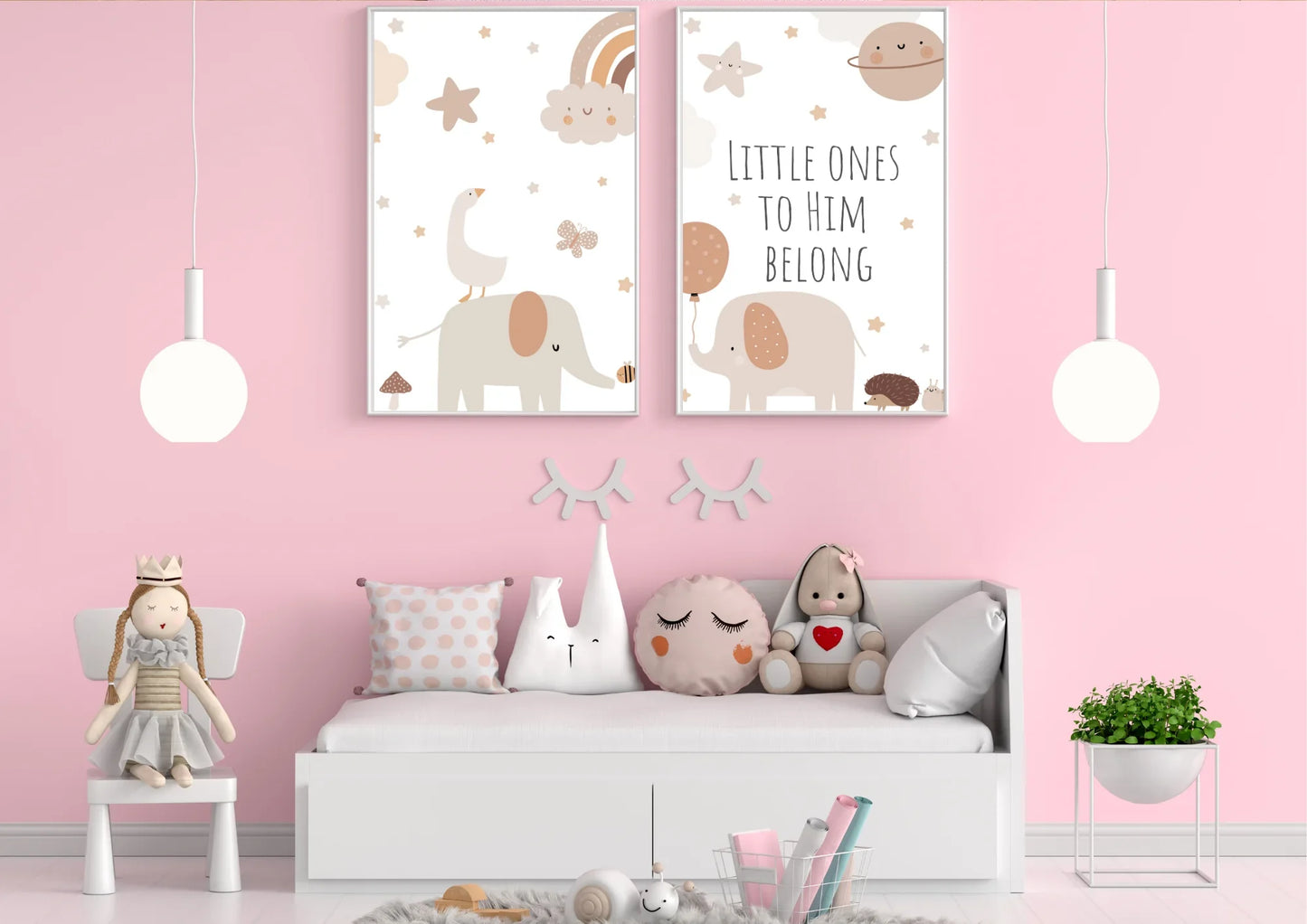 A set of two framed art prints with elephants and the quote "Little ones to him belong" on a pink wall above a daybed.