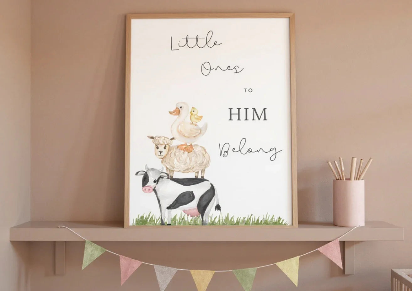 Framed artwork with animals and text on a shelf against a beige wall