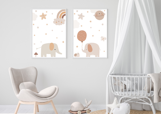 Two framed illustrations of elephants with balloons and stars on a wall in a nursery.