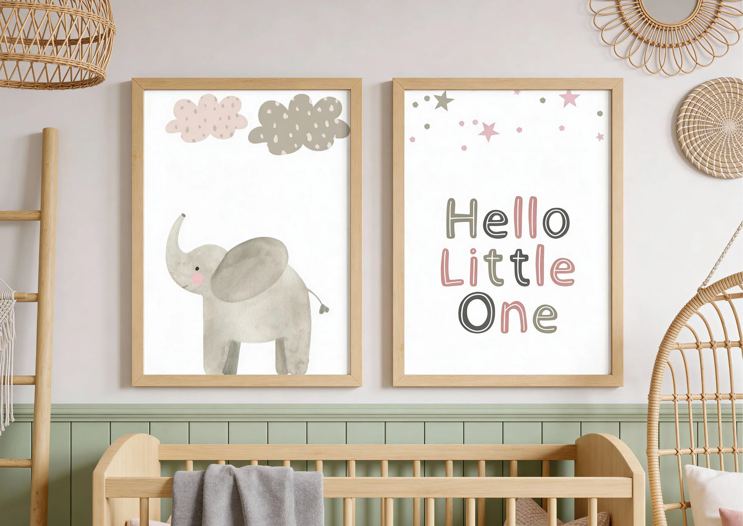 Nursery room with framed prints of an elephant and 'Hello Little One' text, wooden crib, and decorative elements.