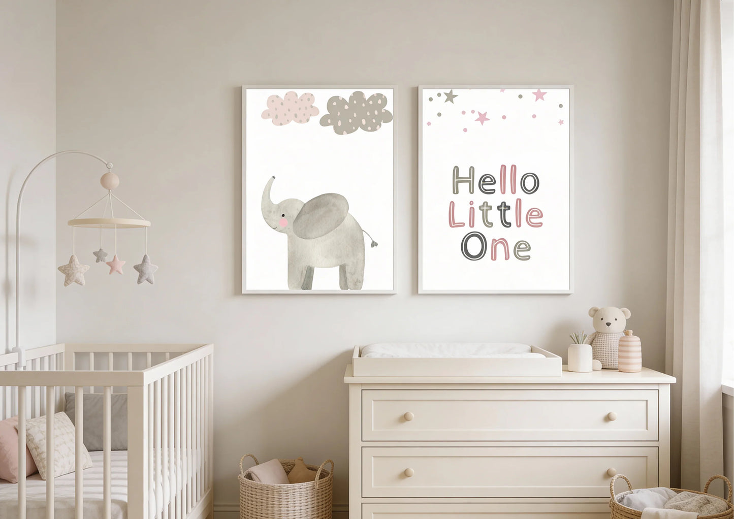 Nursery room with a crib, changing table, and wall art featuring an elephant and text.