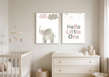Nursery room with a crib, changing table, and wall art featuring an elephant and text.