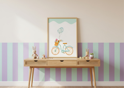 Framed artwork of a bicycle with balloons on a wall with striped wallpaper.