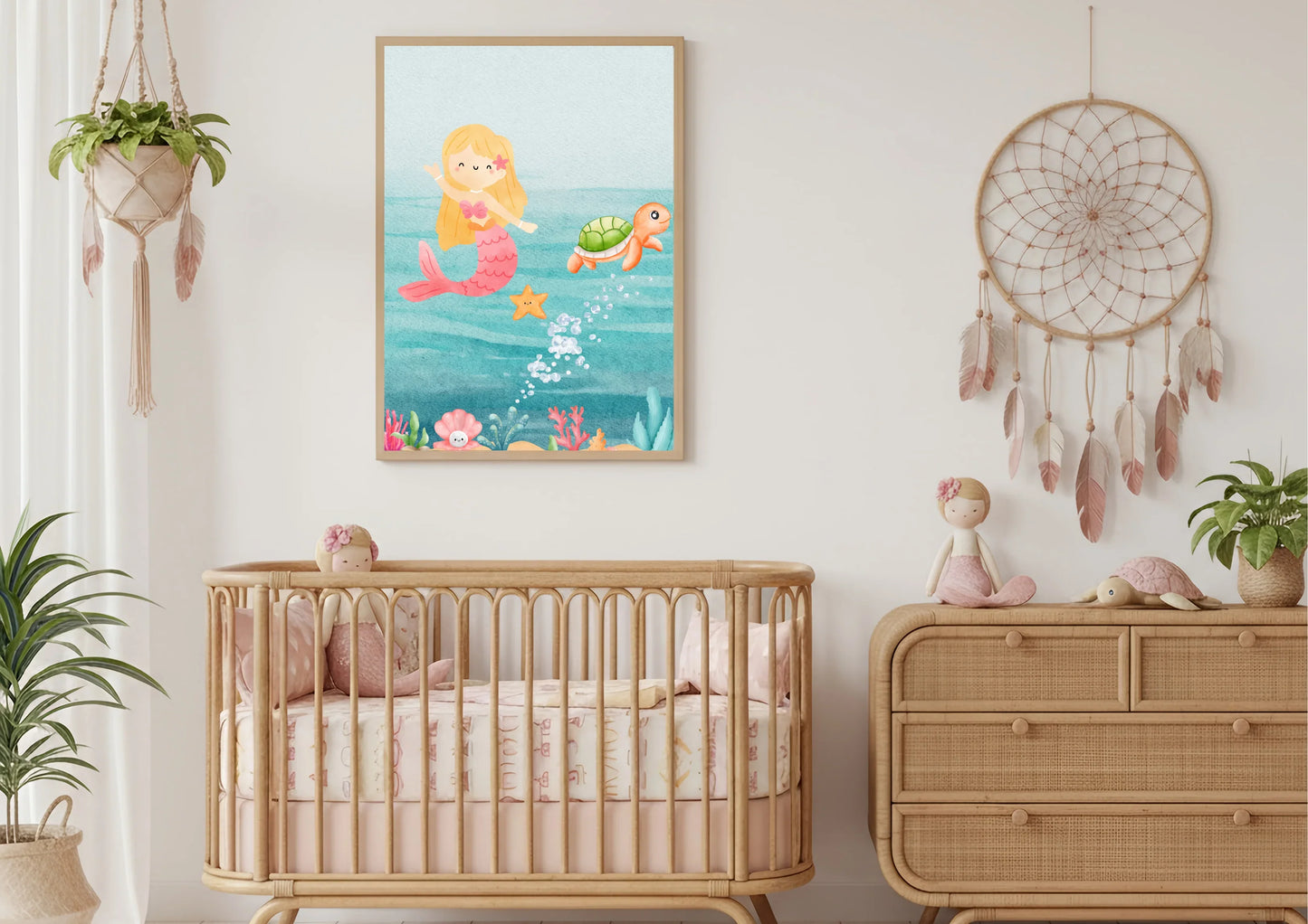 Nursery room with a crib, dresser, and wall art of mermaids and sea creatures.