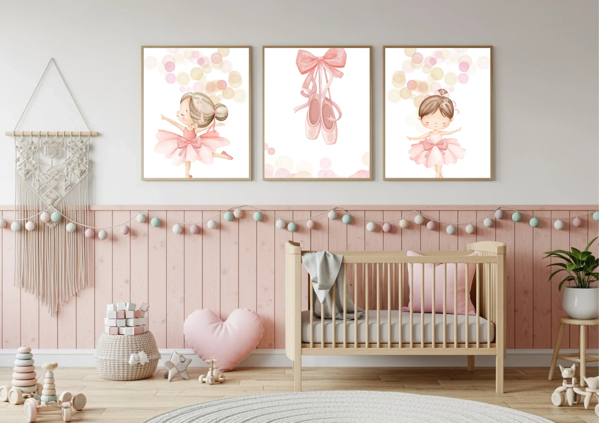 Children's room with a crib, toys, and ballerina wall art in a pastel color scheme.