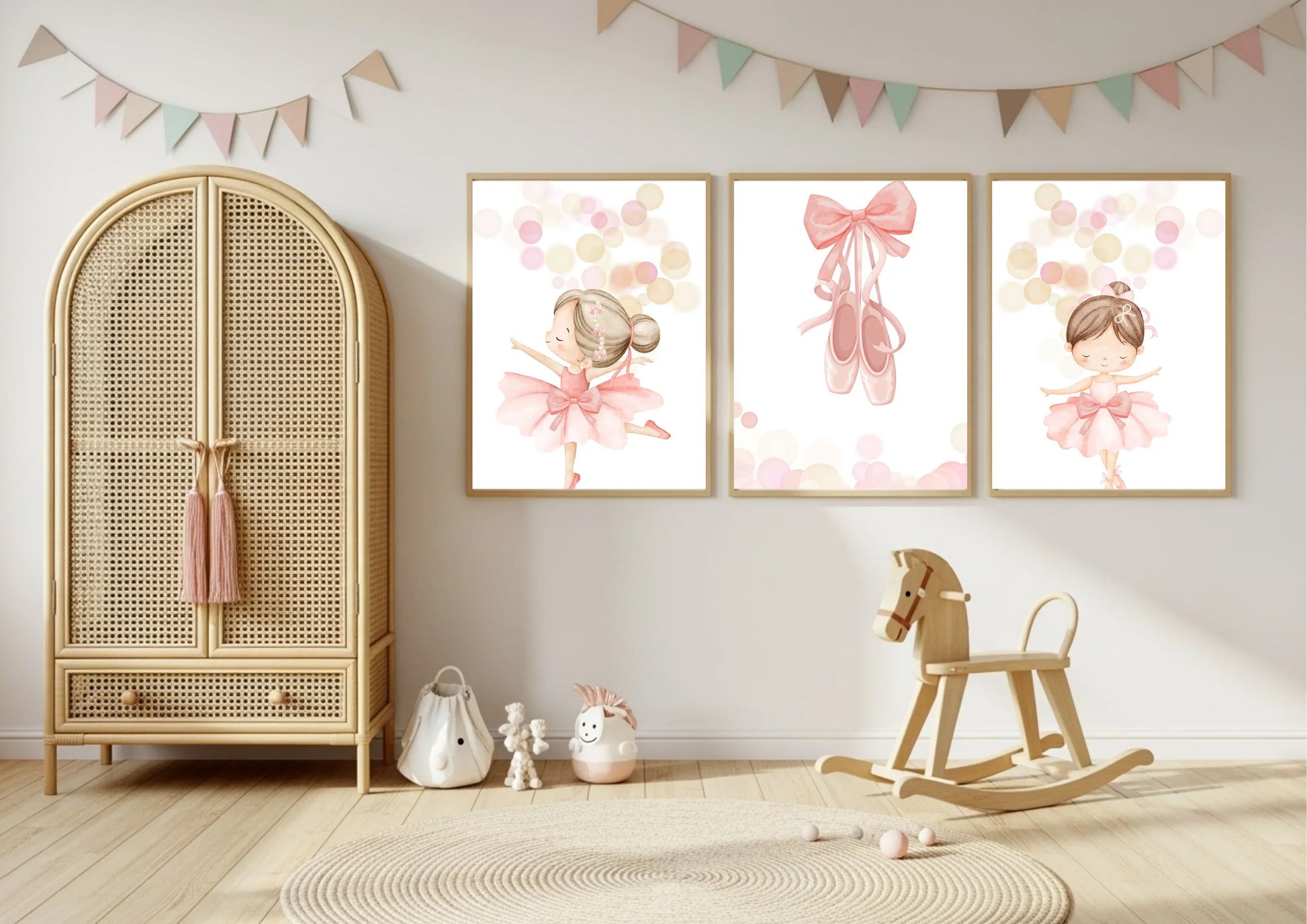 Nursery room with wicker wardrobe, rocking horse, and wall art of ballerinas.