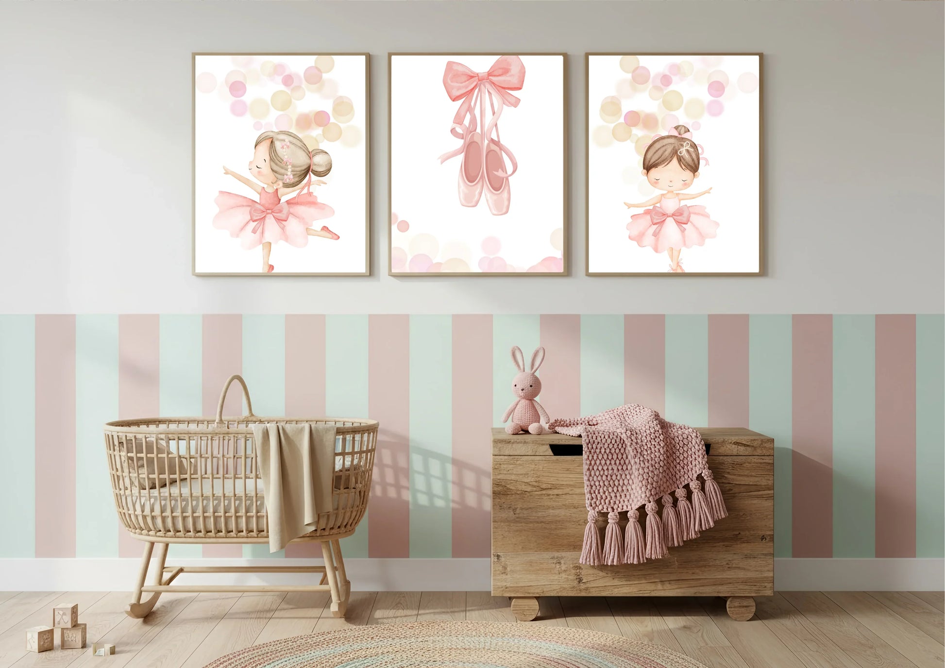 Nursery room with ballerina themed decorative wall art, wooden crib, and toy chest.