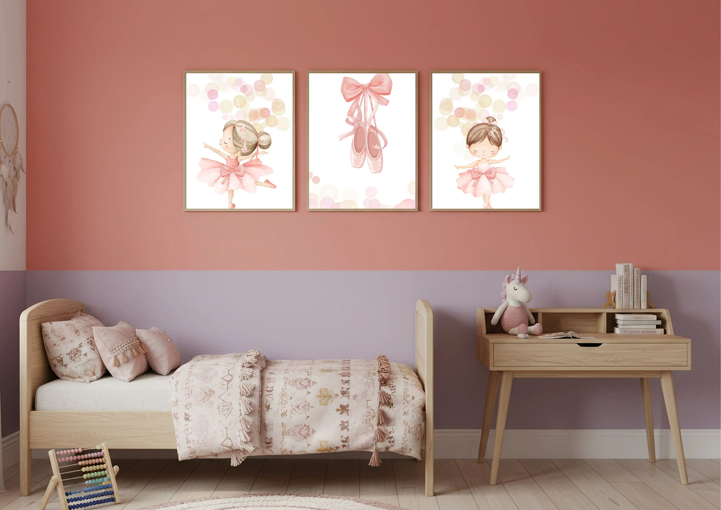 Children's bedroom with a bed, desk, and wall art featuring ballerinas.