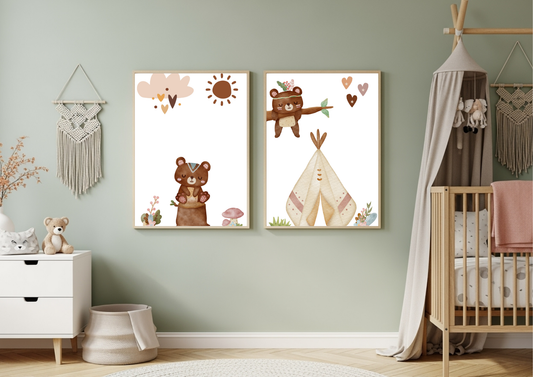 A set of two framed Aztec tribal woodland bear nursery prints hanging on a sage green wall, styled above a crib with a boho canopy and next to a white dresser with a teddy bear and macrame wall hangings.