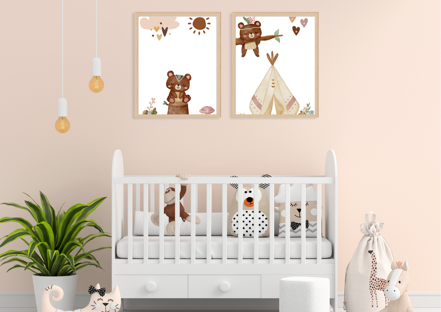 A neutral-toned nursery with soft peach walls. Two framed Aztec tribal woodland bear prints hang above a white wooden crib, which is decorated with playful black and white animal pillows. A large green houseplant sits to the left.