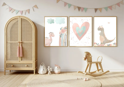 A rattan wardrobe | Three prints on a wall featuring a pink dinosaur, a rainbow, a large heart, and a dinosaur with a flower crown.