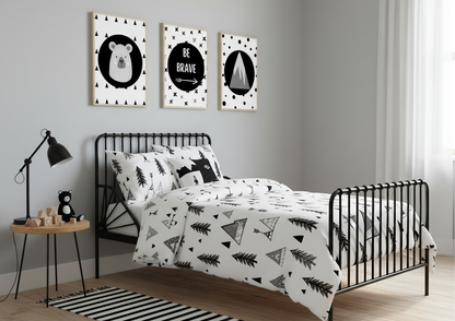 Bedroom with black metal bed, white bedding with black patterns, and wall art.