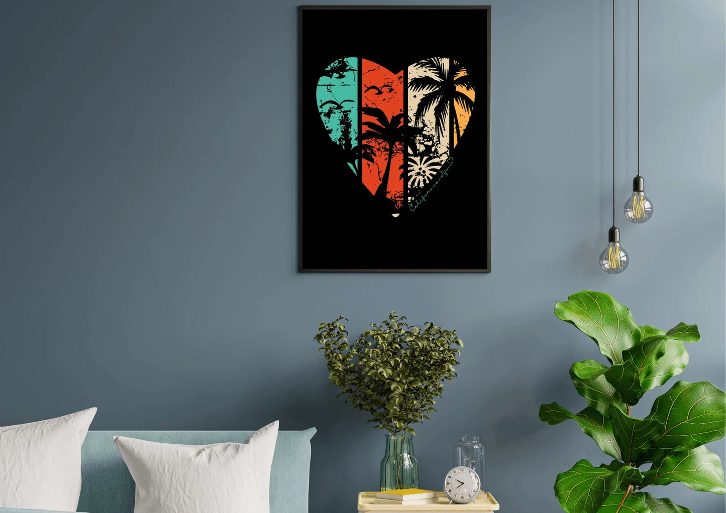 Framed artwork of a heart with tropical designs on a blue wall above a sofa.