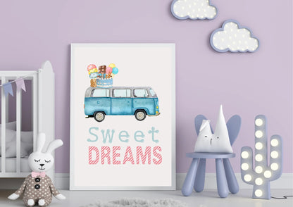 A large framed art print is centered against a light lavender wall in a child's room. The artwork is a watercolor illustration of a blue, vintage Volkswagen van (VW bus) with a stack of ice cream cones, popsicles, and a birthday cake on its roof. Below the image, the text "Sweet DREAMS" is written in a playful light blue and striped pink font.