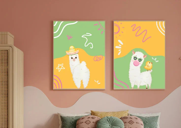 Two colorful wall art prints of llamas on a pink wall.