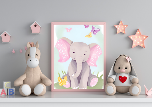 A framed digital art print of a baby elephant with pink ears and butterflies, leaning against a gray wall on a white shelf. A light brown horse plush toy is on the left, and a beige stuffed rabbit with a red heart on its chest is on the right. Pink star-shaped lights are hanging on the wall.