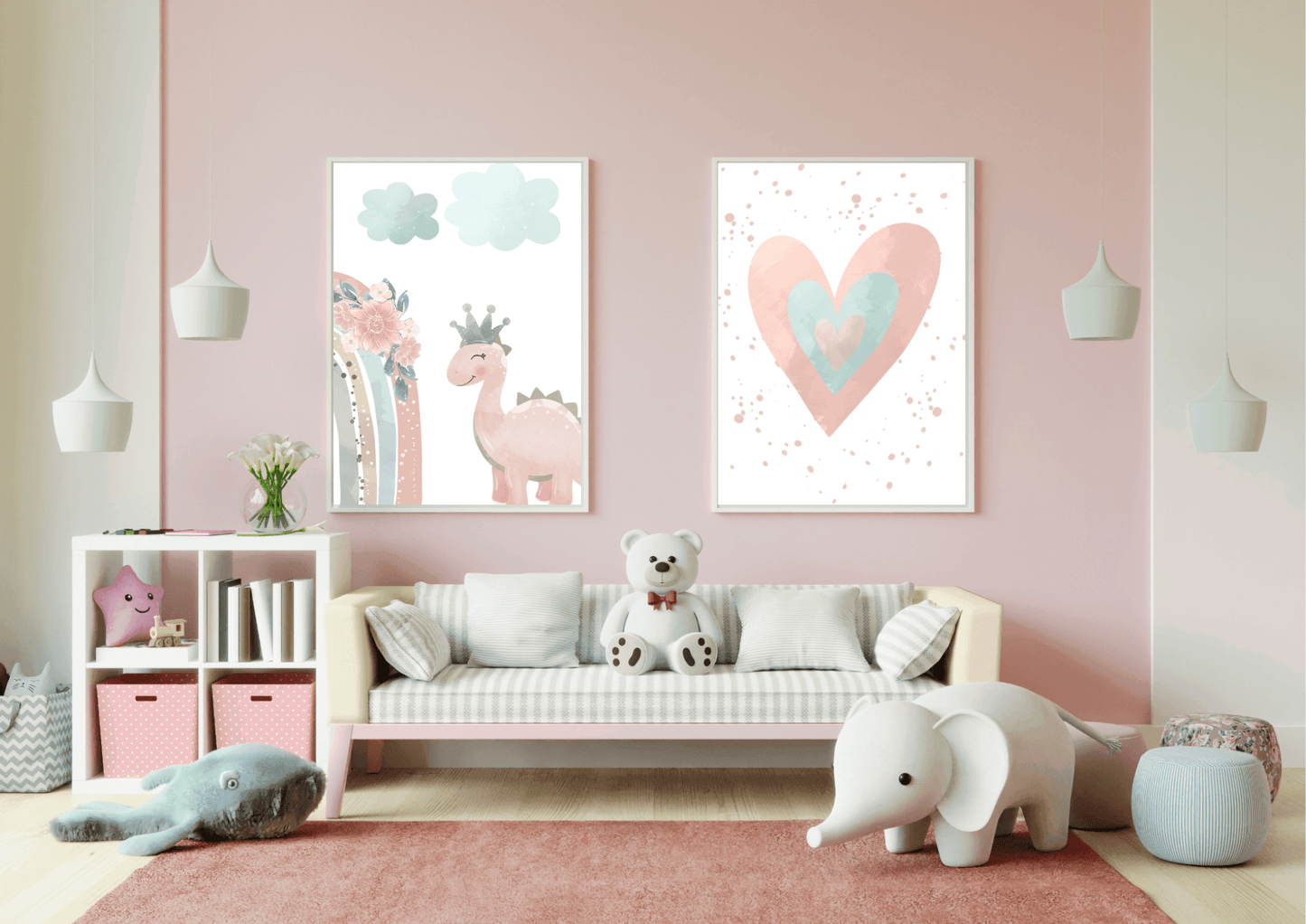 A colorful and modern playroom with a pink wall. Two framed prints show a cute pink dinosaur with a crown and a watercolor heart. The room also features a small sofa with a teddy bear, a white shelf with storage bins, and hanging pendant lights, creating a fun and inviting space.