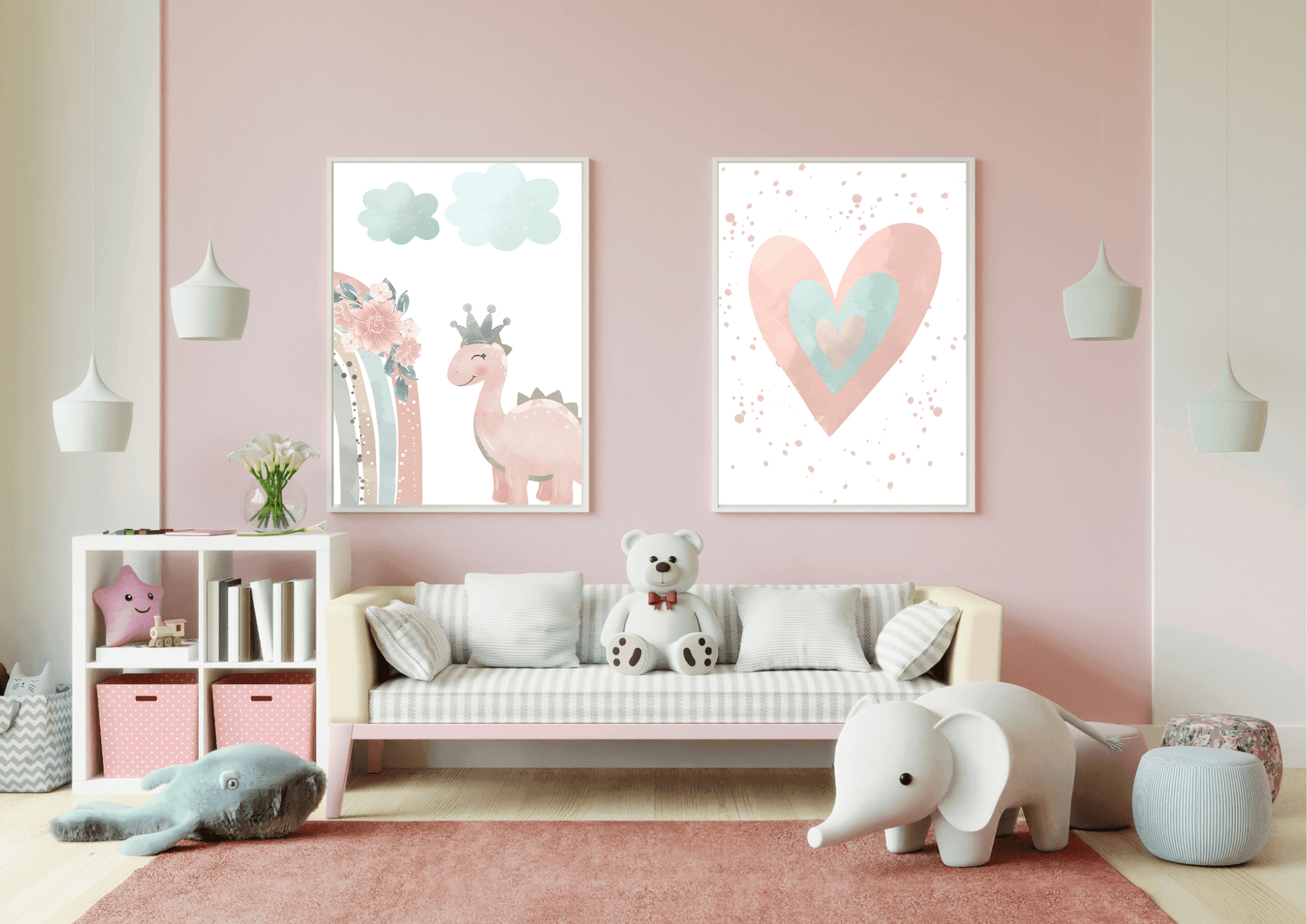 A colorful and modern playroom with a pink wall. Two framed prints show a cute pink dinosaur with a crown and a watercolor heart. The room also features a small sofa with a teddy bear, a white shelf with storage bins, and hanging pendant lights, creating a fun and inviting space.