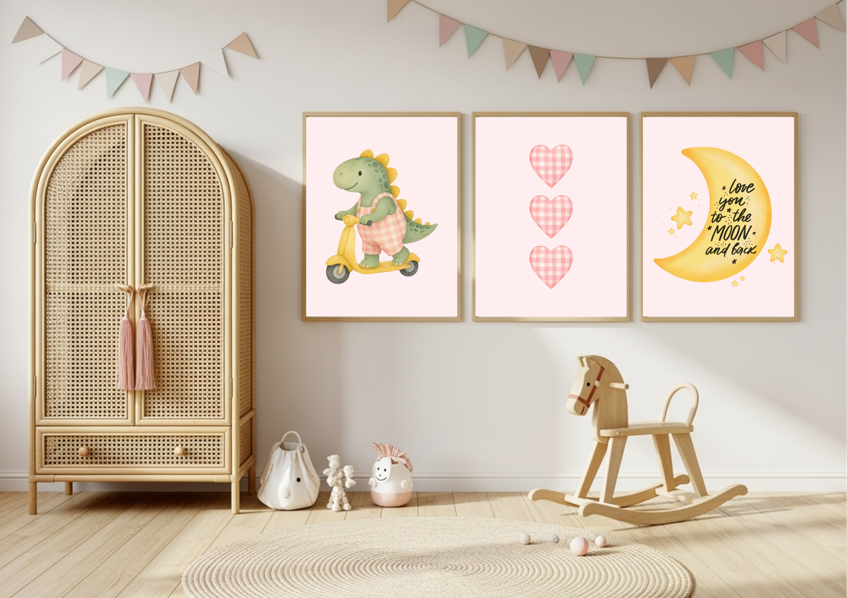 Three framed nursery wall art prints displayed on a light gray wall in a styled children's room. The left print shows a green dinosaur riding a yellow scooter, the center print has three pink plaid hearts, and the right print shows a yellow crescent moon with the text 'Love you, to the MOON and back' with small yellow stars.