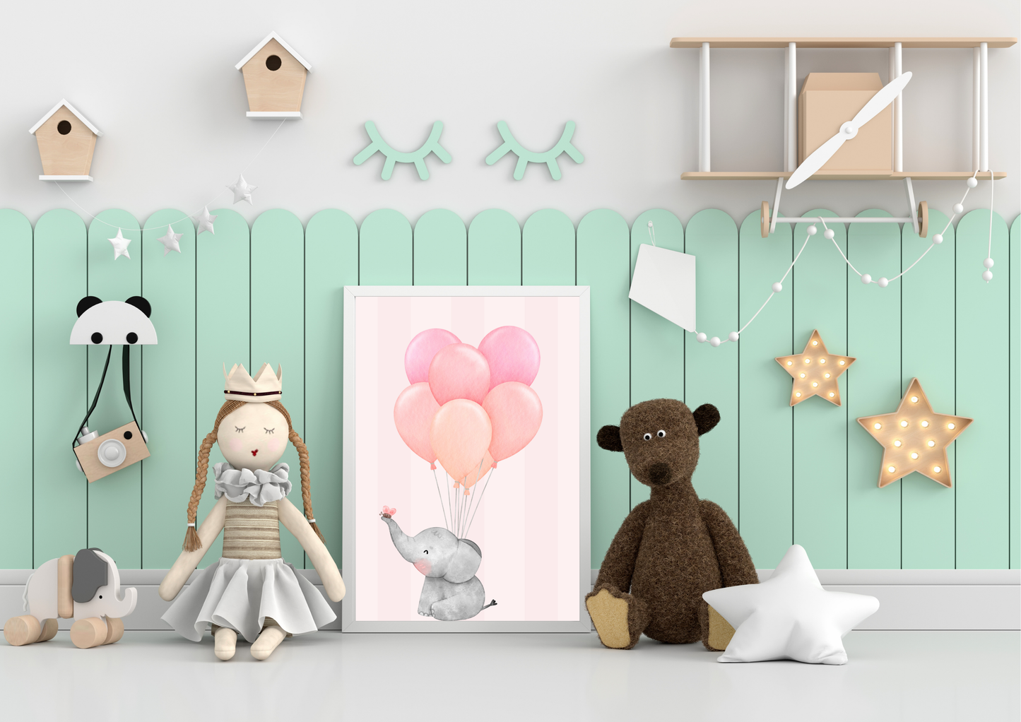 Children's room decor with toys, an elephant poster, and wall decorations against a light green wall.