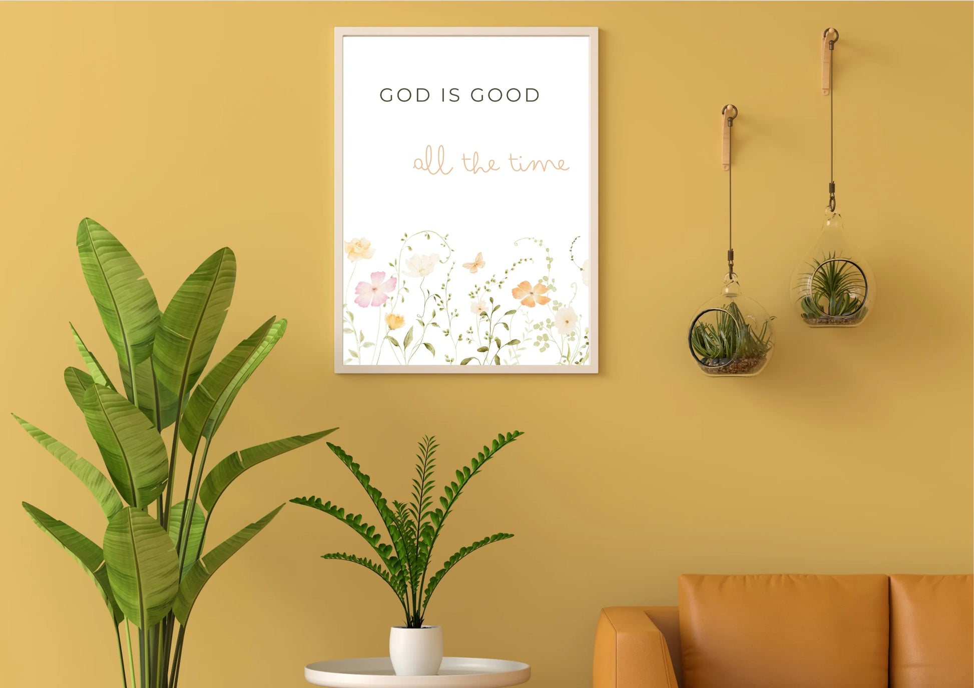 Yellow wall with a framed print, plants, and a brown sofa.