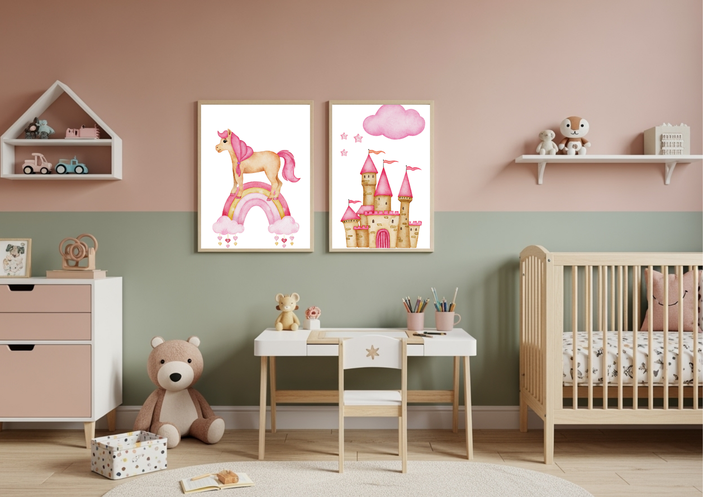 A children's room with a two-tone wall, featuring framed watercolor prints of a unicorn on a rainbow and a princess castle. Below the prints is a small white and wood child's desk. To the left is a pink and white dresser with a shelf above it, and to the right is a natural wood crib and a white floating shelf.