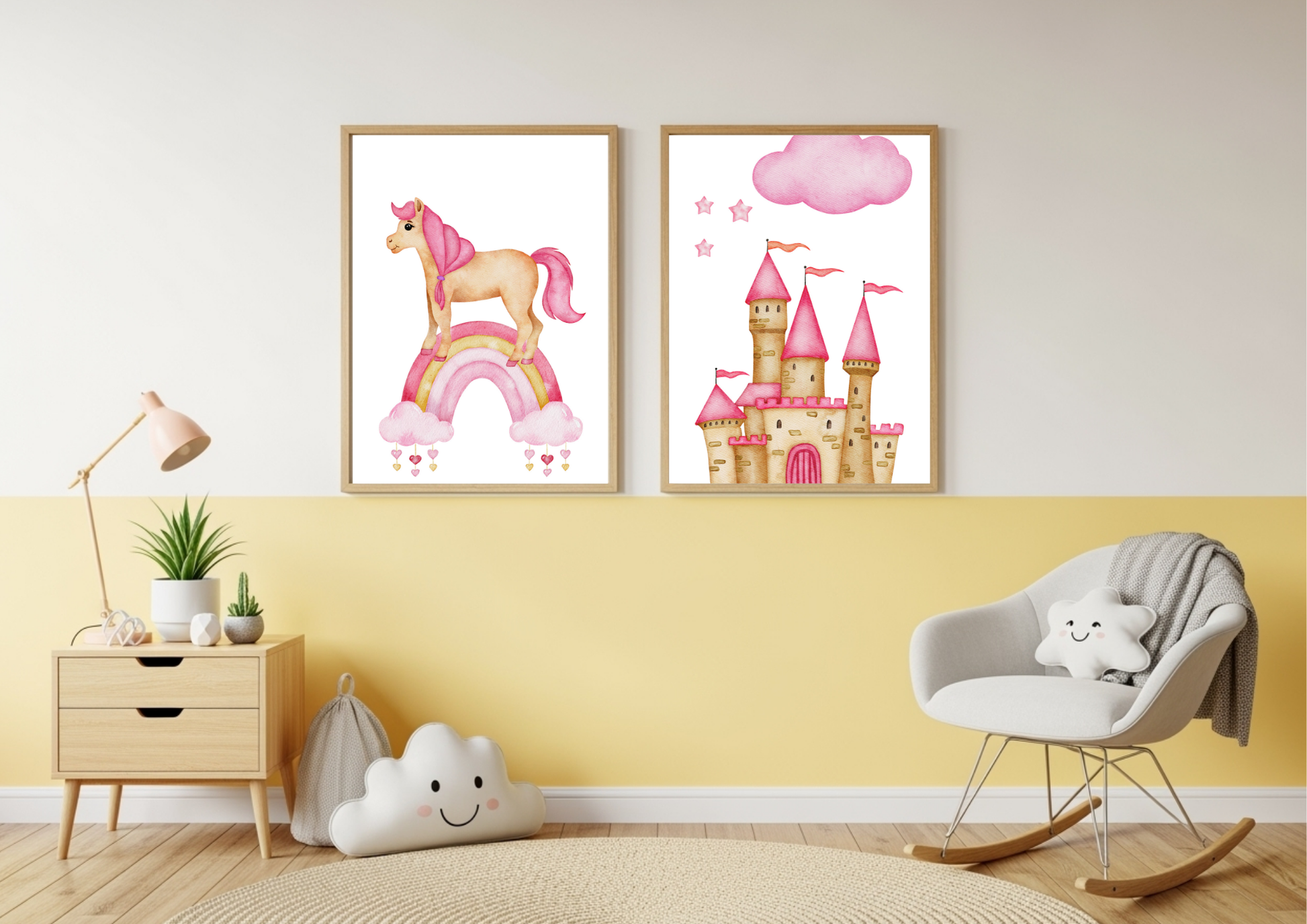 Two framed watercolor prints, one featuring a unicorn on a rainbow and the other a pink princess castle, hang on a wall split between yellow on the bottom and white on the top. To the left is a wooden nightstand with a lamp and a plant. To the right is a white rocking chair with a cloud-shaped pillow.