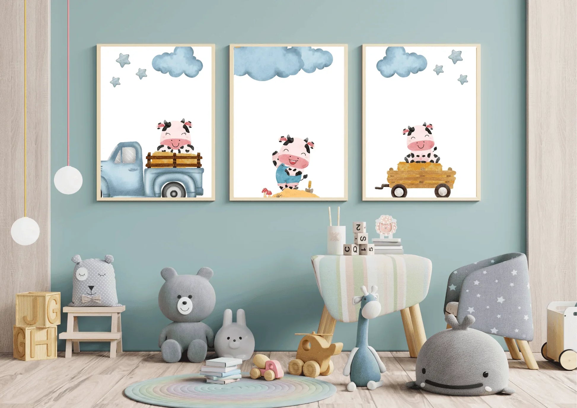 Three framed Farm Cow Nursery Art prints displayed in a modern child's playroom with teal walls and various toys.