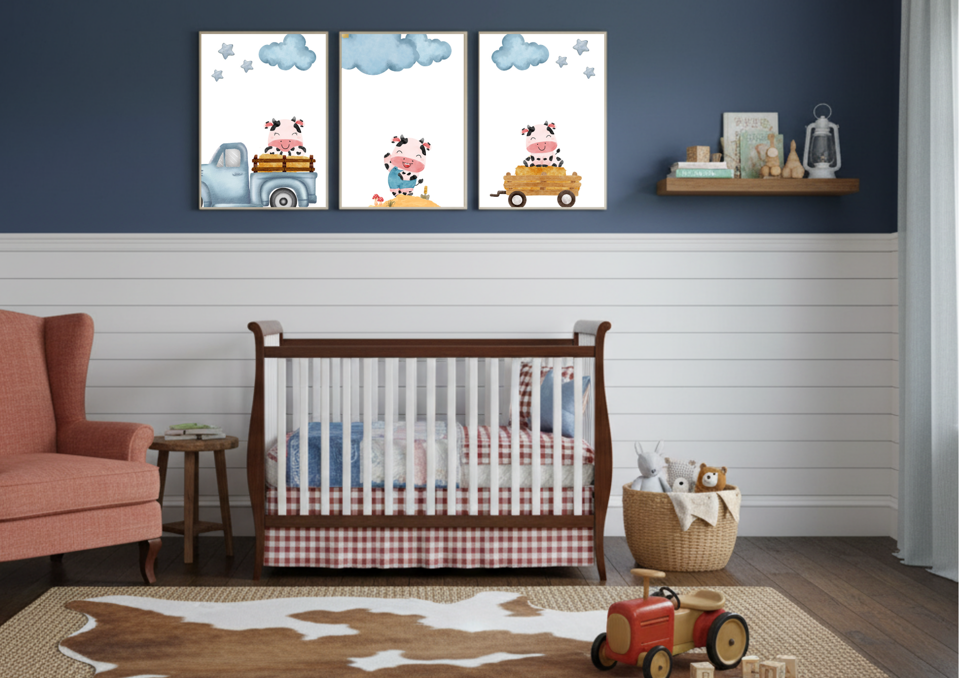 Three framed Farm Cow Nursery Art prints displayed over a crib, featuring a blue and barn red color scheme and wooden furniture.