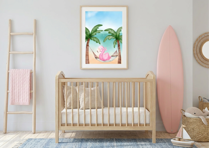 Watercolor flamingo nursery wall art featuring a pink flamingo in a tropical hammock between palm trees, framed above a light wood crib. Coastal-themed baby room with a pink decorative surfboard, a wooden ladder with a pink blanket, and beach-inspired toys. Modern boho nursery decor with a light oak crib, blue textured rug, and tropical flamingo beach art print.