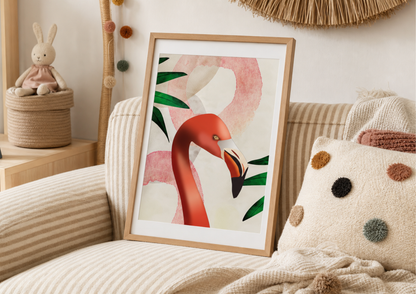 A framed art print featuring a stylized pink flamingo with green leaves, leaning against a beige striped sofa in a cozy, decorated room.