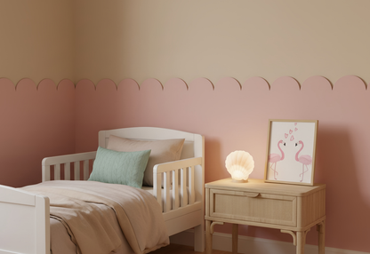 Children's bedroom with a bed and nightstand against a pink wall, and flamingo wall art.
