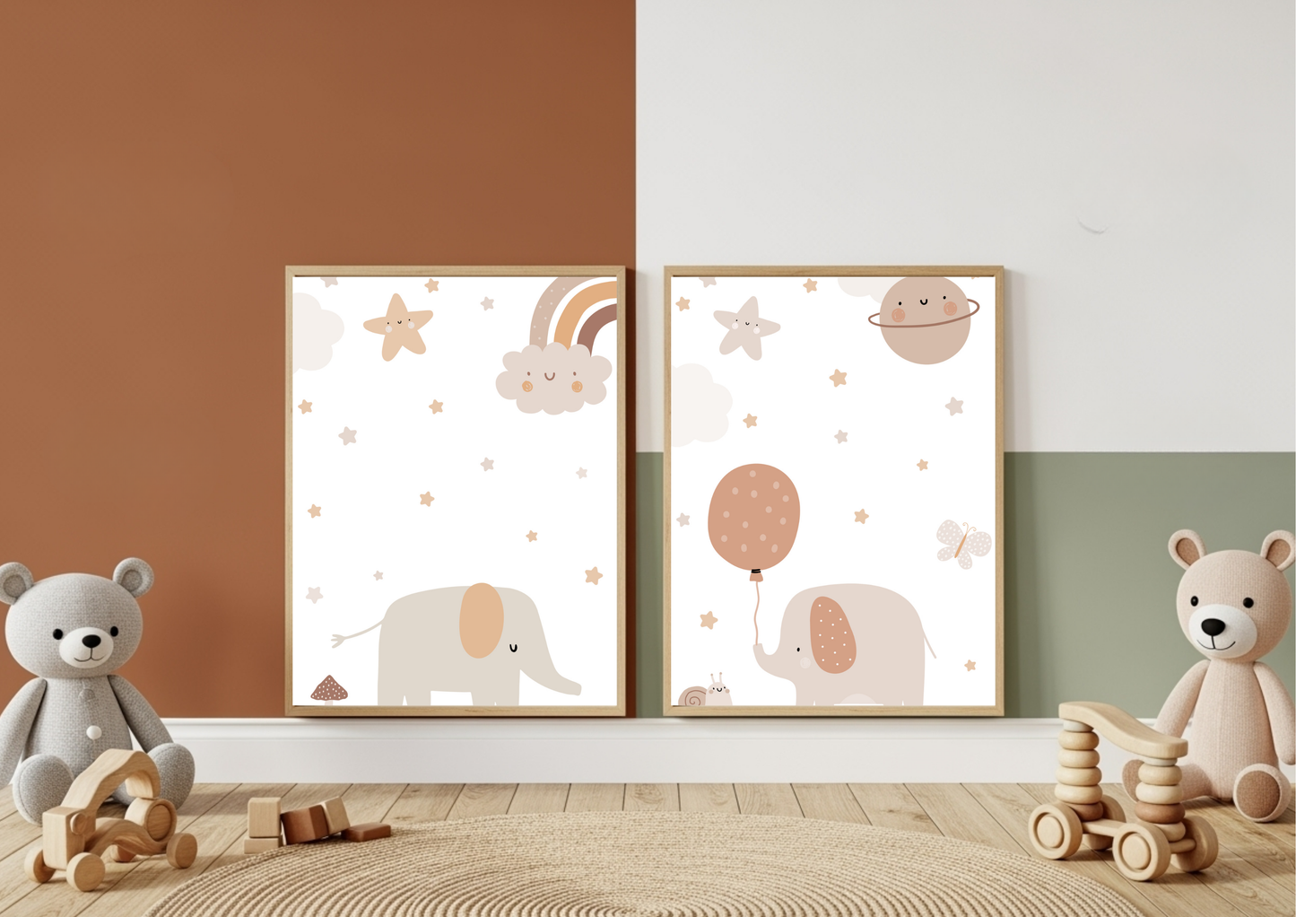 
A close-up shot of a set of two framed nursery prints featuring cute elephants, stars, and planets in neutral, earthy tones, resting against a wall split between terracotta orange, white, and sage green paint blocks. Two plush teddy bears and wooden toys sit on a jute rug in the foreground.