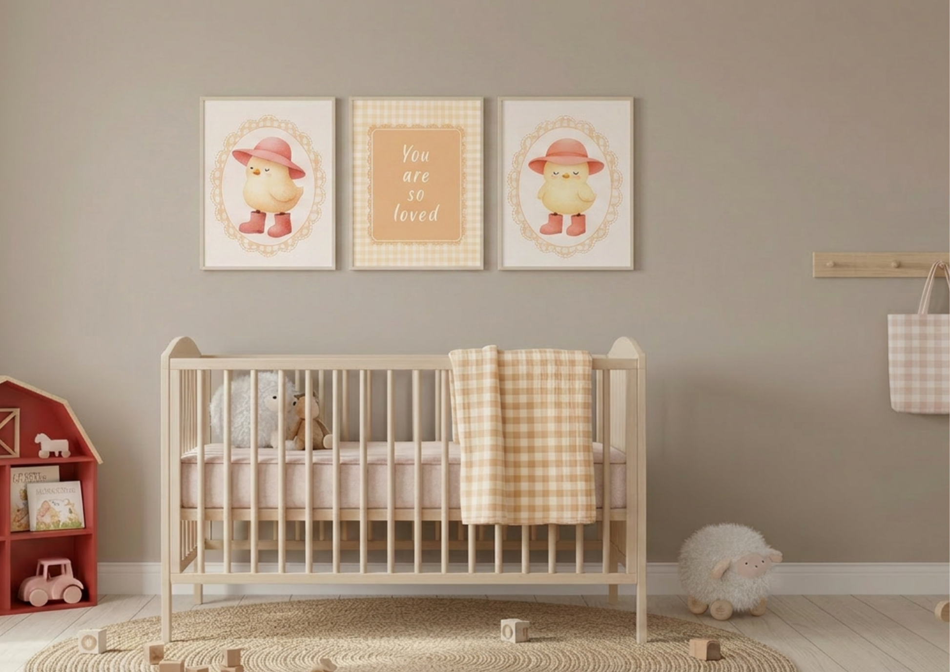 Nursery room with a crib, toys, and framed baby chic pictures on the wall.