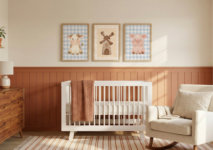Nursery room with a white crib, wooden dresser, and framed animal prints on the wall.