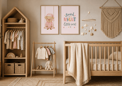 A styled nursery interior featuring a wooden house-shaped wardrobe, a baby crib with a cream throw blanket, a small wooden clothing rack, framed wall art including one that reads 'good NIGHT little one', a macrame wall hanging, and a hanging mobile.