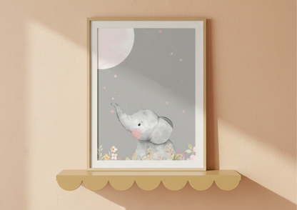 Framed artwork of a baby elephant on a scalloped shelf, on a beige wall
