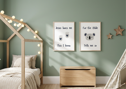 Sage green nursery with "Jesus Loves Me" and koala watercolor framed wall art prints hanging above a wooden toy chest.