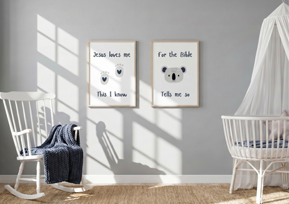 Grey nursery with "Jesus Loves Me" and koala watercolor framed wall art prints hanging above a white rocking chair and crib.