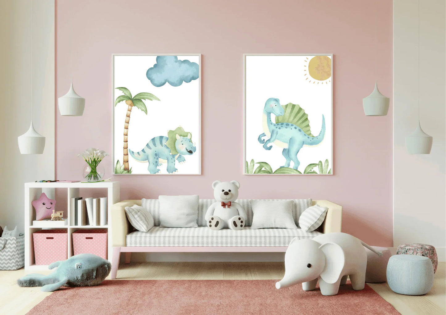 A set of two watercolor dinosaur art prints in white frames on a pink wall above a small couch.