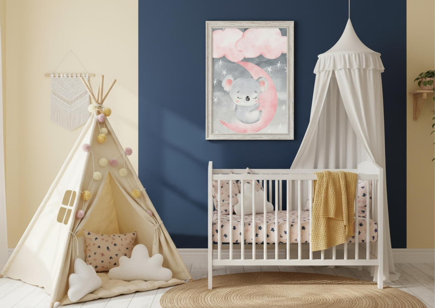A vibrant and playful nursery room with a two-toned wall: navy blue on the right and light yellow on the left. A white-framed watercolor print of a koala sleeping on a pink moon beneath pink clouds hangs on the dark blue accent wall, positioned above a white crib with a white canopy. To the left, a cream-colored teepee decorated with pom-pom garlands provides a cozy play area. The room is grounded by a round woven jute rug and features bedding with a subtle pink pattern and a bright yellow blanket draped ov
